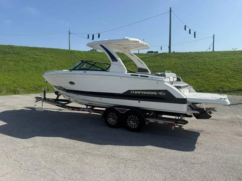 Slide: The Image of 2026 Chaparral SSX 30 on a trailer, featuring a sleek design and spacious deck. - 13