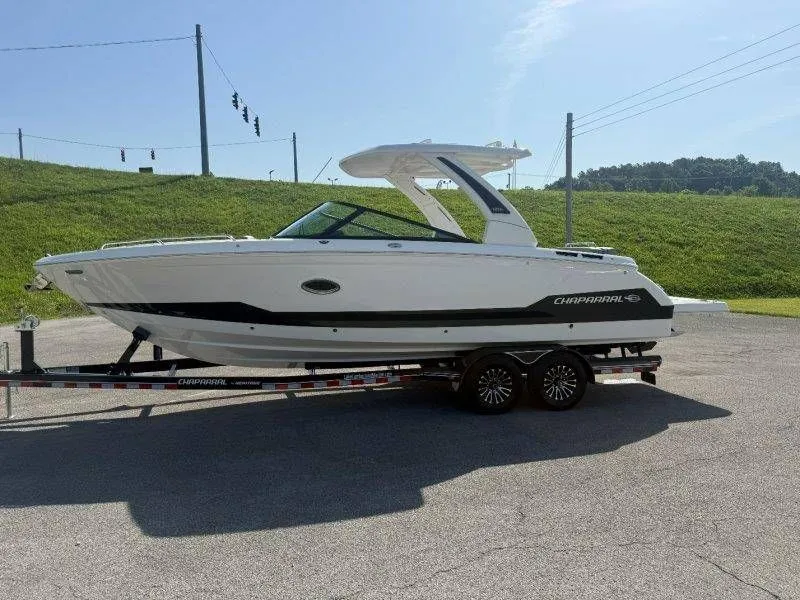 Slide: The Image of Chaparral SSX 30 boat on a trailer on land. - 11