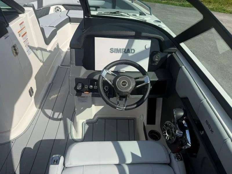 Slide: The Image of Interior view of a modern boat with steering wheel and Simrad display. - 28