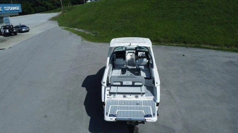 Slide: The Image of Aerial view of a white Chaparral SSX 30 boat on a parking lot. - 44