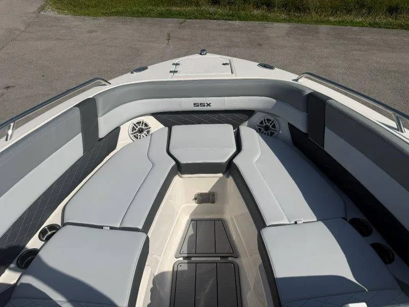 Slide: The Image of The image shows the bow area of a Chaparral SSX 30 boat with gray upholstery. - 23