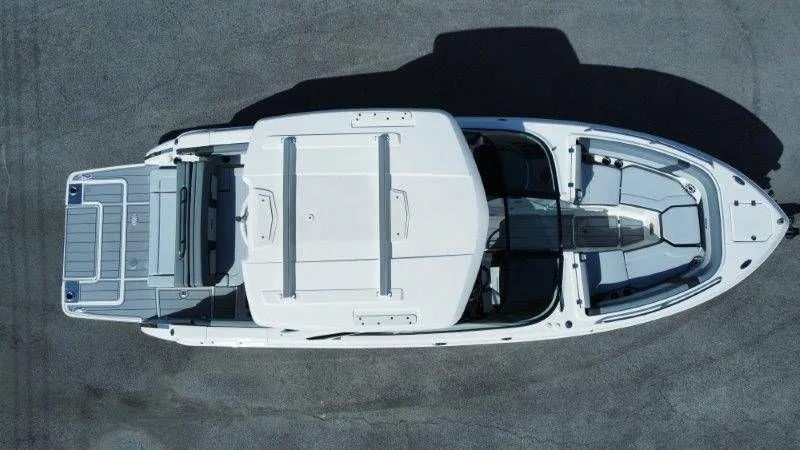 Slide: The Image of Aerial view of a white Chaparral SSX 30 boat on dry ground. - 4