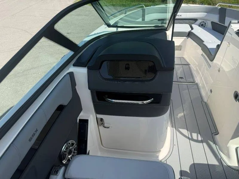 Slide: The Image of Interior of a 2026 Chaparral SSX 30 with gray upholstery and modern features. - 29