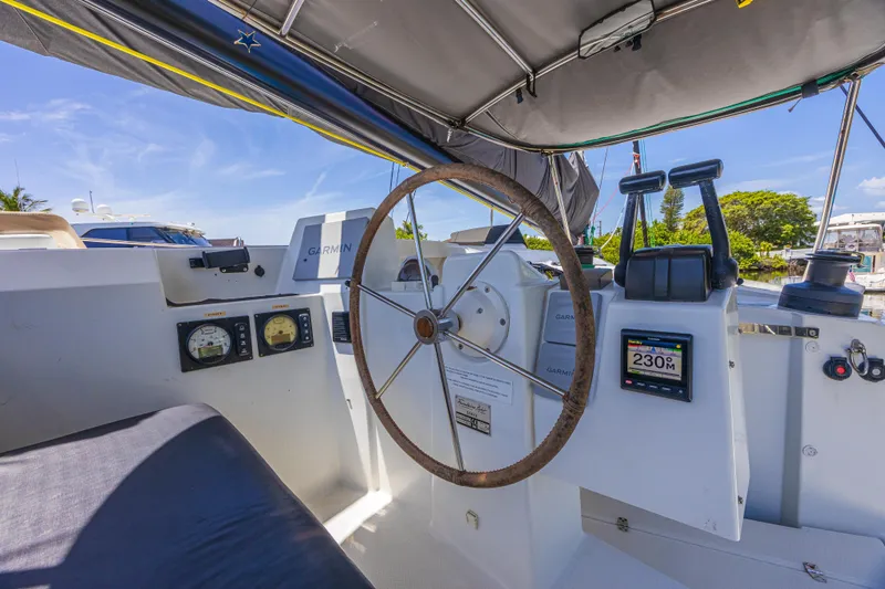 Slide: The Image of Cockpit of 2015 Fountaine Pajot Sanya 57 catamaran with steering wheel and navigation instruments. - 42