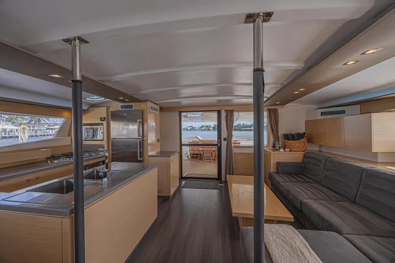 Slide: The Image of Luxurious interior of 2015 Fountaine Pajot Sanya 57 yacht with modern kitchen and seating area. - 6