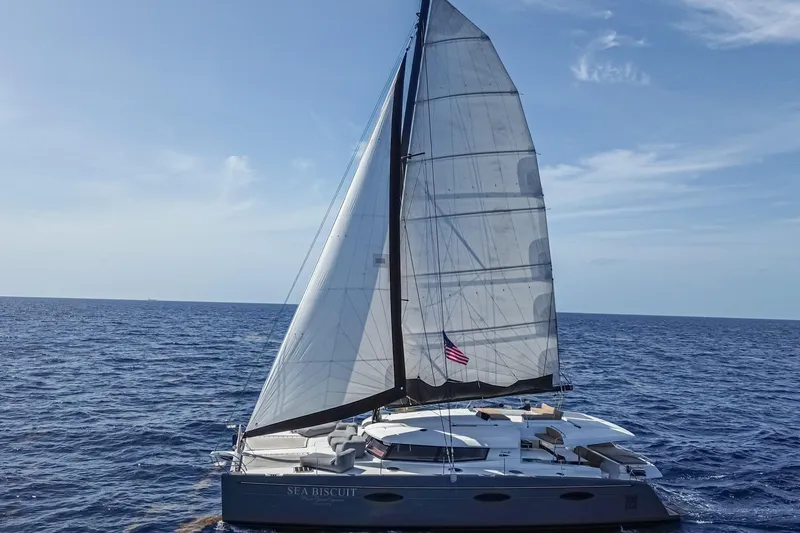 Slide: The Image of Sailing catamaran Fountaine Pajot Sanya 57, 2015 model, on open sea with full sails. - 59