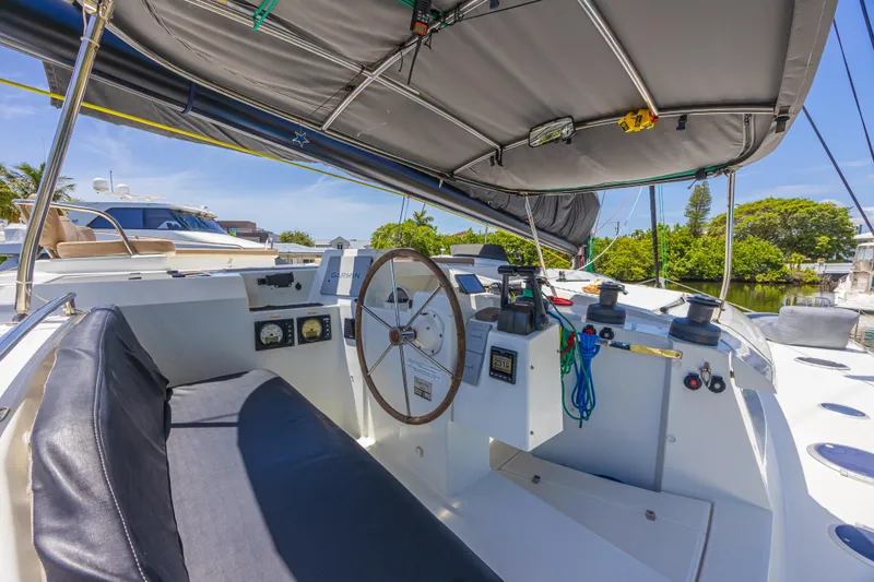 Slide: The Image of Helm of 2015 Fountaine Pajot Sanya 57 catamaran with navigation equipment and seating. - 41