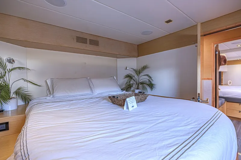 Slide: The Image of Luxurious bedroom interior of 2015 Fountaine Pajot Sanya 57 yacht with elegant bedding. - 18