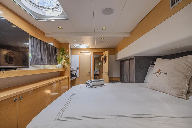 Slide: The Image of Luxurious cabin interior of 2015 Fountaine Pajot Sanya 57 yacht, featuring elegant wood finishes. - 16
