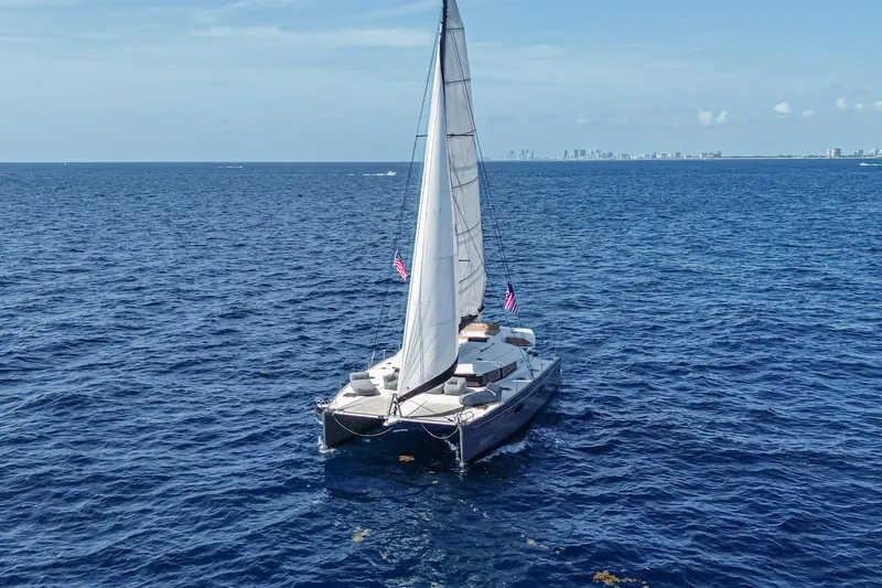 Slide: The Image of Sailing catamaran Fountaine Pajot Sanya 57, 2015 model, cruising on open ocean waters. - 54