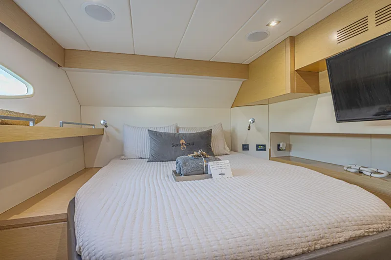 Slide: The Image of Luxurious cabin interior of 2015 Fountaine Pajot Sanya 57 yacht with cozy bedding and modern amenities. - 26