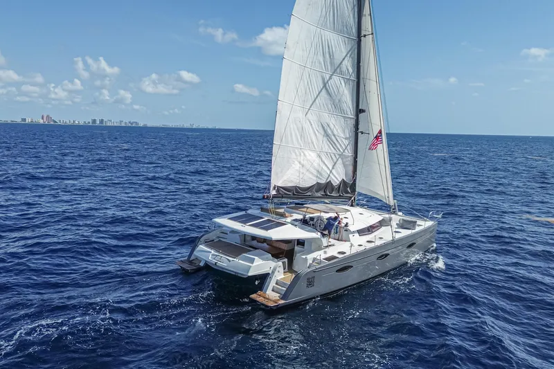 Slide: The Image of Sailing catamaran Fountaine Pajot Sanya 57, 2015 model, cruising on open ocean waters. - 55