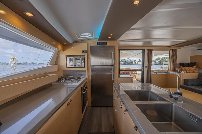 Slide: The Image of Luxurious interior of 2015 Fountaine Pajot Sanya 57 yacht kitchen with modern amenities. - 10