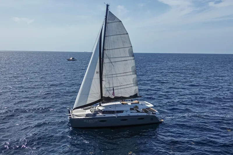Slide: The Image of 2015 Fountaine Pajot Sanya 57 catamaran sailing on open sea under clear skies. - 45
