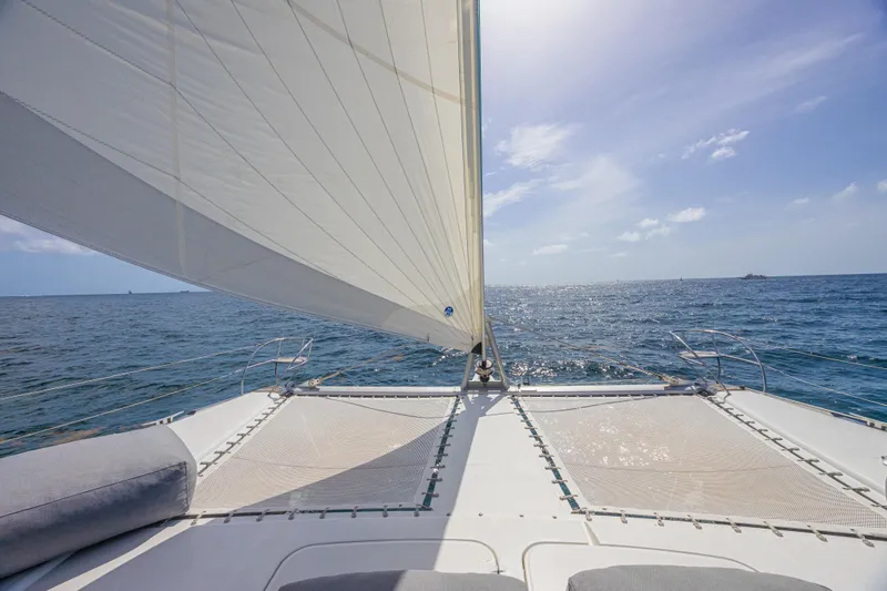 Slide: The Image of Sailing on a 2015 Fountaine Pajot Sanya 57 catamaran under clear blue skies. - 38
