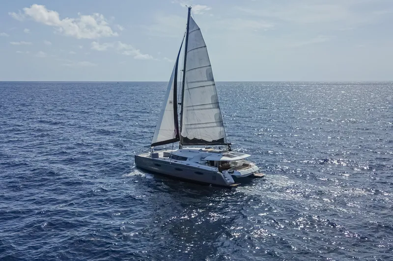 Slide: The Image of Sailing catamaran Fountaine Pajot Sanya 57, 2015 model, cruising on open ocean waters. - 51