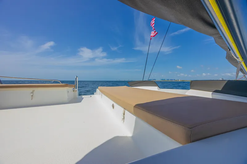 Slide: The Image of Luxurious deck of 2015 Fountaine Pajot Sanya 57 catamaran under clear blue sky. - 36