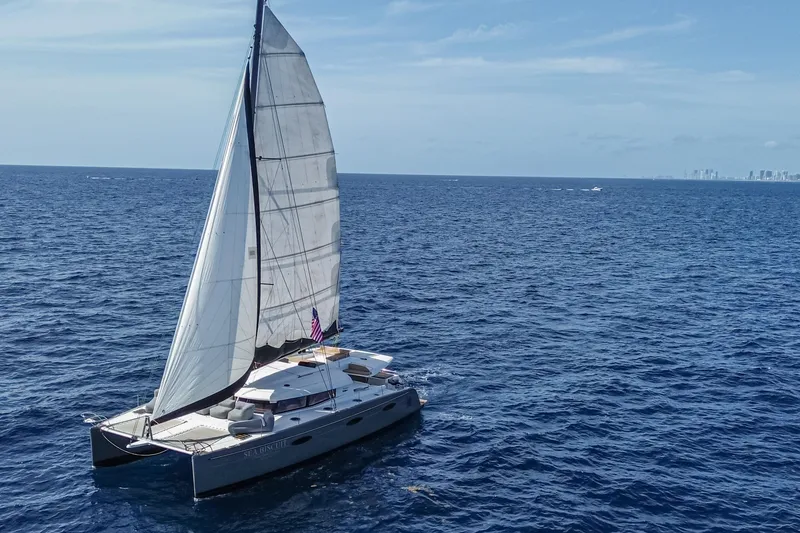 Slide: The Image of Sailing catamaran Fountaine Pajot Sanya 57, 2015 model, cruising on open ocean waters. - 60