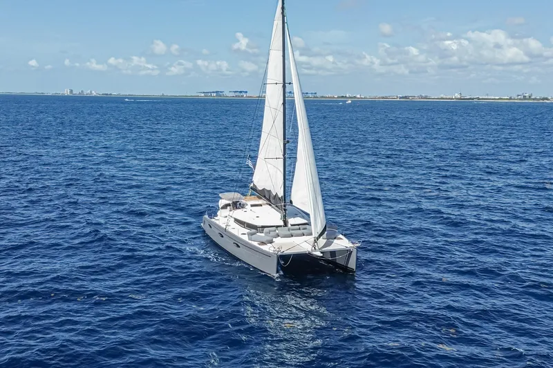 Slide: The Image of Sailing catamaran Fountaine Pajot Sanya 57, 2015 model, cruising on open blue sea. - 63