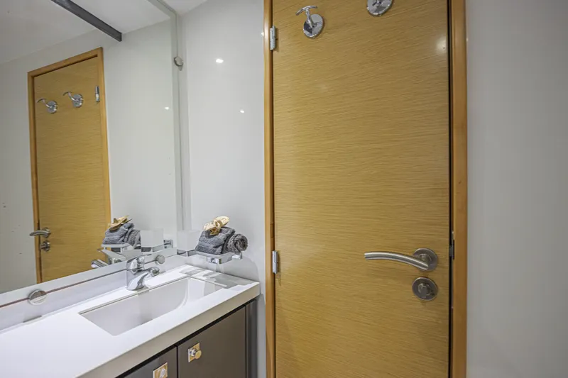 Slide: The Image of Bathroom interior of 2015 Fountaine Pajot Sanya 57 yacht with modern sink and wooden door. - 30