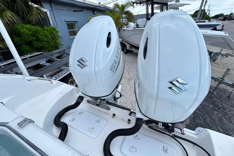 Slide: The Image of 2023 Sea Pro 259 Center Console with dual Suzuki outboard motors. - 20