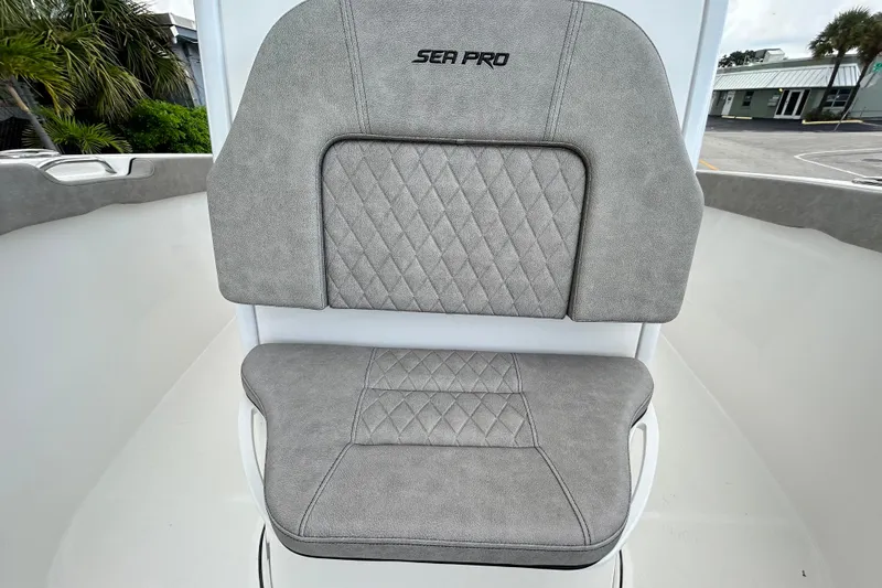 Slide: The Image of 2023 Sea Pro 259 Center Console boat seat with gray upholstery and diamond stitching. - 12