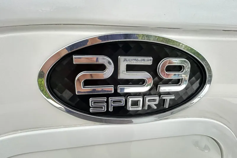 Slide: The Image of Chrome "259 Sport" emblem on 2023 Sea Pro 259 Center Console boat. - 16