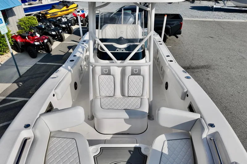 Slide: The Image of 2024 Sea Fox 248 Commander boat interior with white seating and modern design. - 23