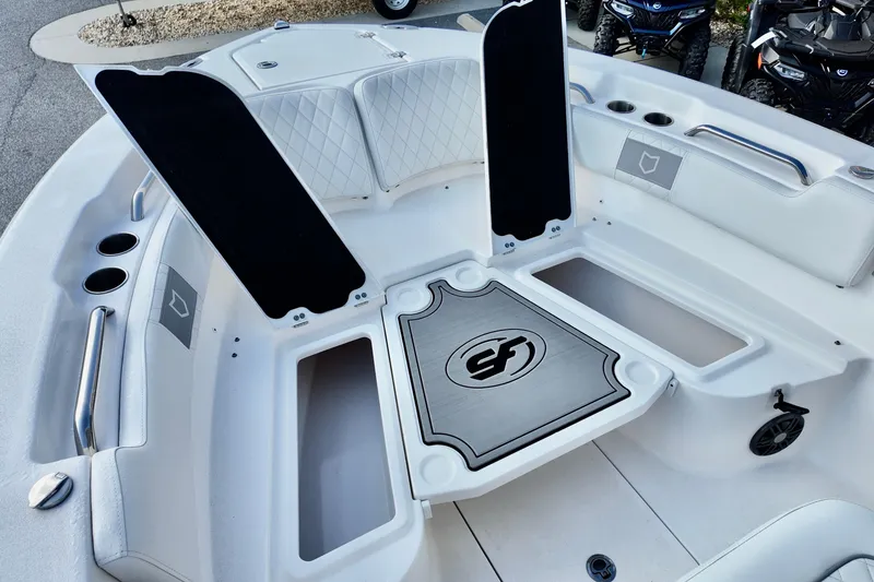 Slide: The Image of 2024 Sea Fox 248 Commander boat interior with storage compartments and seating. - 9