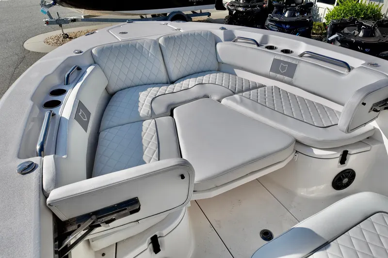 Slide: The Image of Luxurious seating on 2024 Sea Fox 248 Commander boat, featuring quilted upholstery and cup holders. - 20