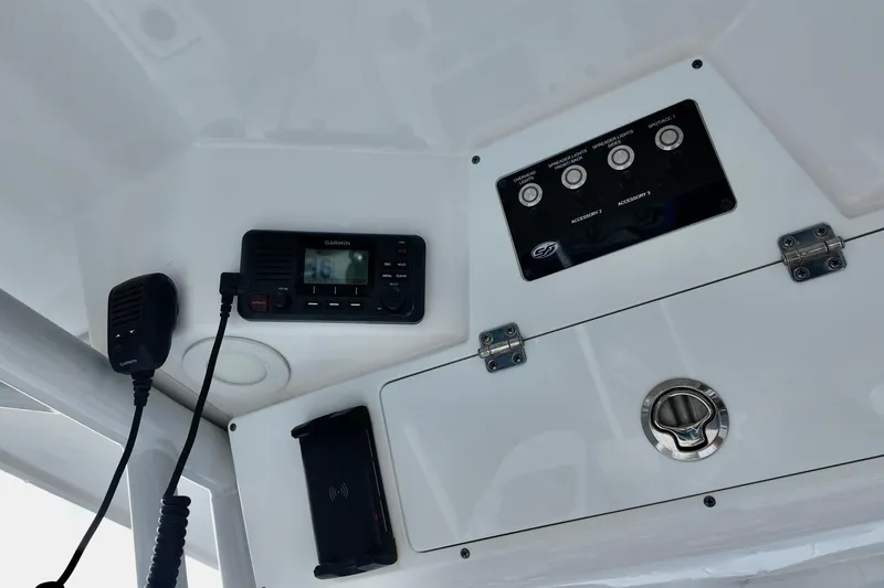 Slide: The Image of 2024 Sea Fox 248 Commander dashboard with Garmin radio and control panel. - 17