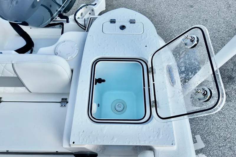 Slide: The Image of 2024 Sea Fox 248 Commander boat with open livewell, showcasing sleek design and functionality. - 14