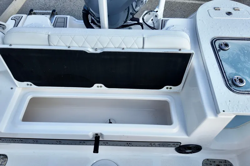 Slide: The Image of 2024 Sea Fox 248 Commander boat interior with storage compartment and seating. - 15