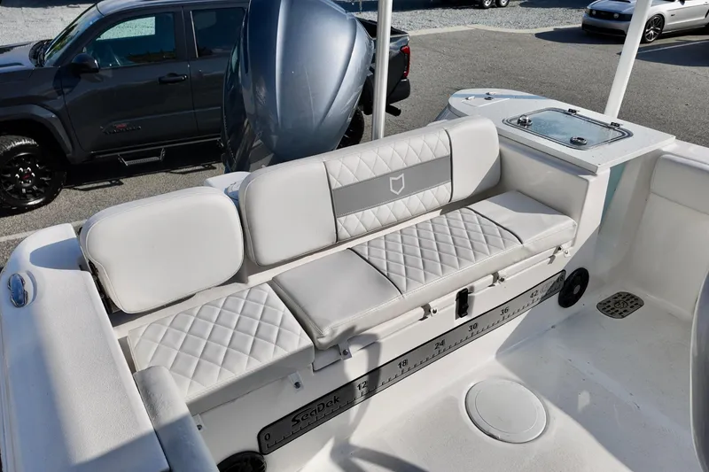 Slide: The Image of 2024 Sea Fox 248 Commander boat interior with cushioned seating and storage compartments. - 24