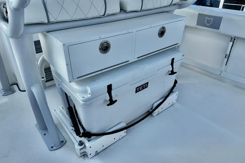 Slide: The Image of 2024 Sea Fox 248 Commander boat interior with Yeti cooler and storage drawers. - 19
