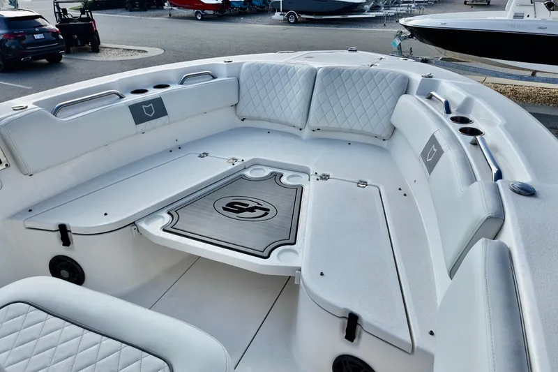 Slide: The Image of 2024 Sea Fox 248 Commander boat interior with cushioned seating and storage compartments. - 10