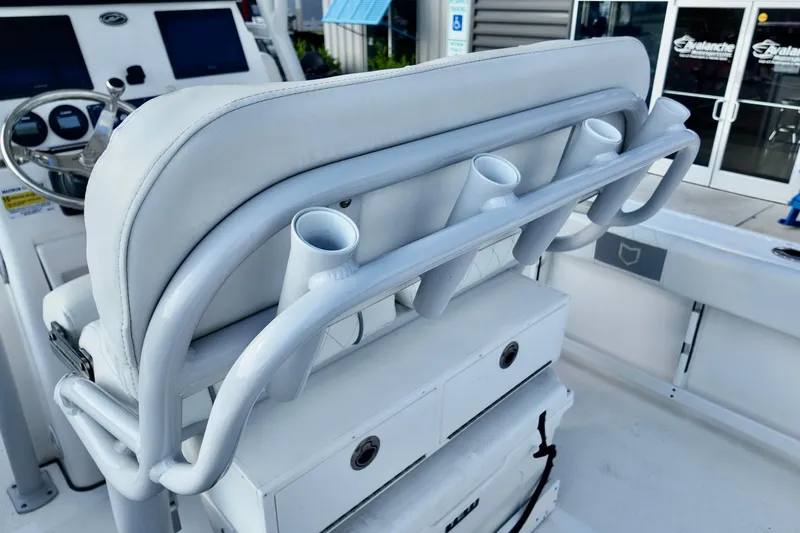 Slide: The Image of 2024 Sea Fox 248 Commander boat interior with rod holders and helm station. - 12