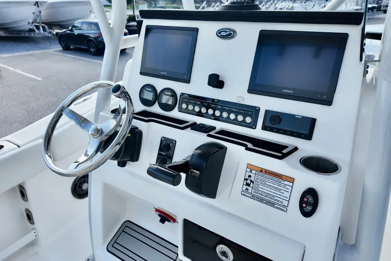 Slide: The Image of 2024 Sea Fox 248 Commander dashboard with steering wheel and electronic displays. - 7