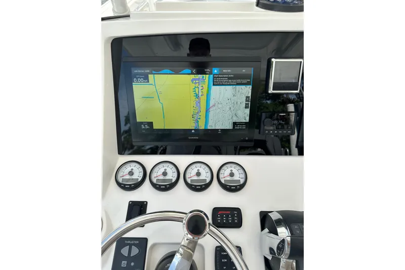 Slide: The Image of Dashboard of a 2013 Intrepid 375 Center Console with navigation display and gauges. - 4