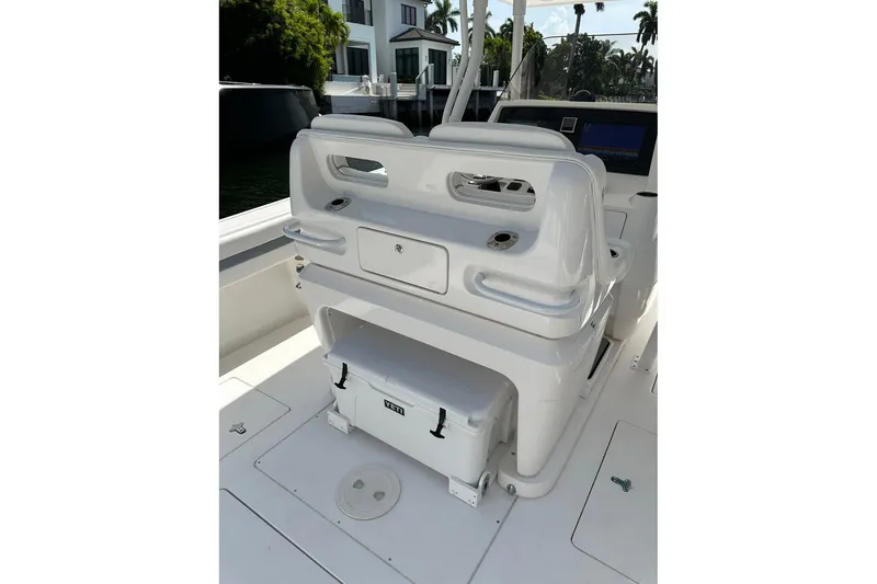 Slide: The Image of 2013 Intrepid 375 Center Console boat interior with seating and Yeti cooler. - 8