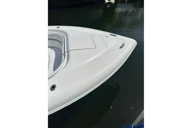 Slide: The Image of Bow of a 2013 Intrepid 375 Center Console boat on calm water. - 19