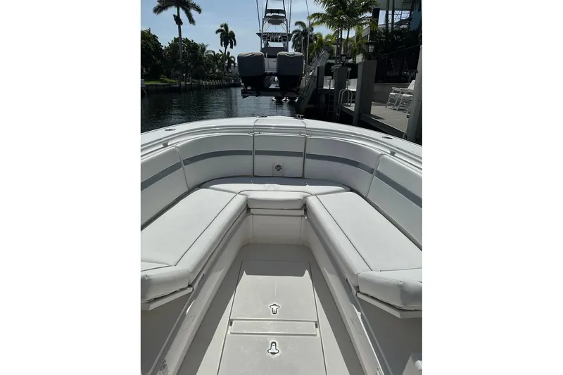 Slide: The Image of 2013 Intrepid 375 Center Console boat with spacious seating and sleek design. - 11