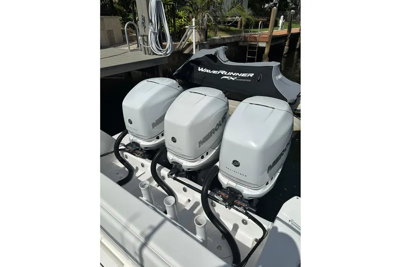 Slide: The Image of Triple Mercury outboard engines on a 2013 Intrepid 375 Center Console boat. - 28