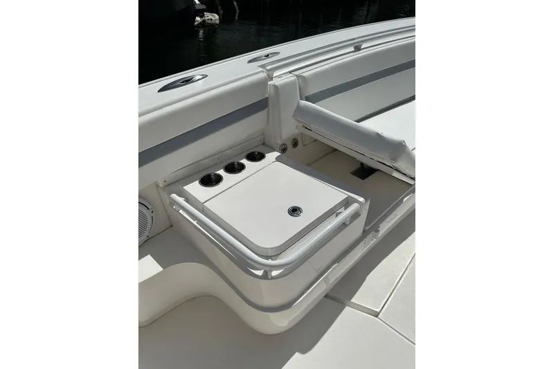 Slide: The Image of 2013 Intrepid 375 Center Console boat interior with seating and storage compartments. - 12