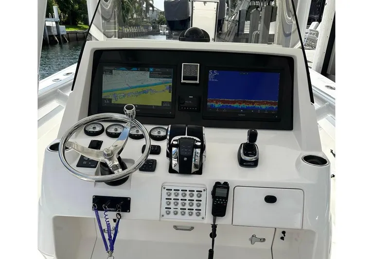 Slide: The Image of 2013 Intrepid 375 Center Console helm with dual displays and modern controls. - 3