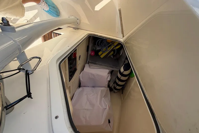 Slide: The Image of Interior storage compartment of a 2018 Scout 215 XSF boat, showing organized equipment. - 28
