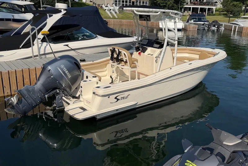 The Image of 2018 Scout 215 XSF boat docked with Yamaha outboard motor in a marina. - 0