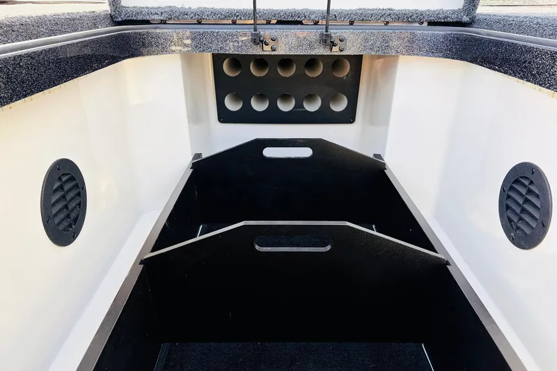 Slide: The Image of Interior storage compartment of 2026 Ranger Z521 boat, featuring organized spaces and ventilation. - 24