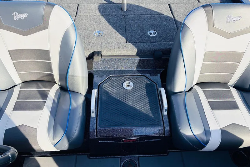 Slide: The Image of 2026 Ranger Z521 boat seats with gray and blue accents, featuring a central storage compartment. - 48