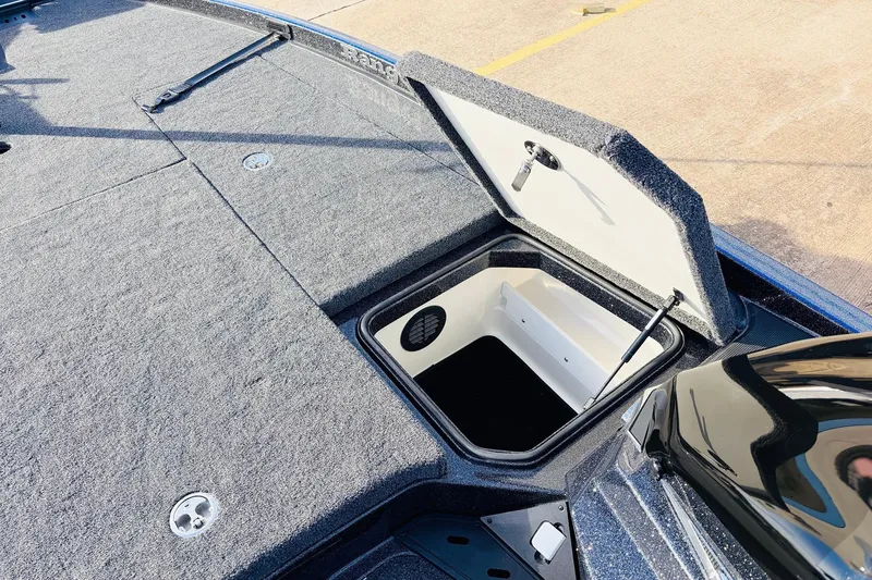 Slide: The Image of 2026 Ranger Z521 boat storage compartment with open hatch, showcasing interior space. - 27